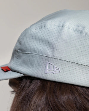 Hermanos Koumori x New Era Camper hat grey on model side view