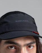 Hermanos Koumori x New Era Camper Cap Black front close up view on Model